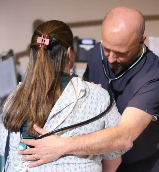 doctor checking a patients breathing
