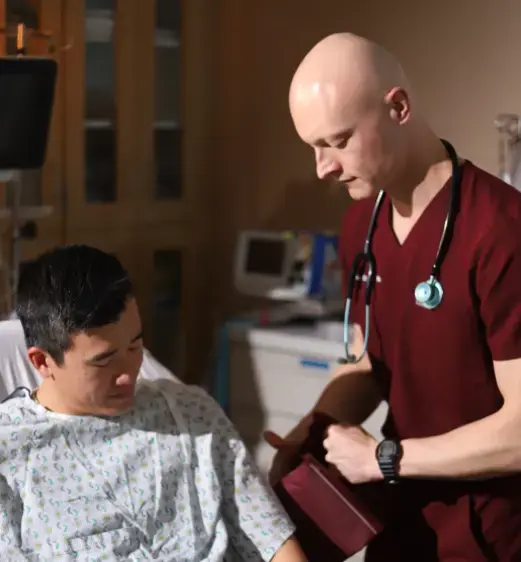Doctor checking a patients heart rate