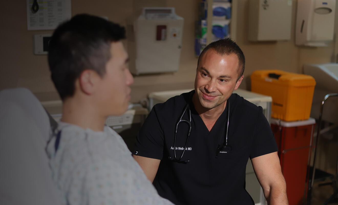 Hospitalist listening to patient