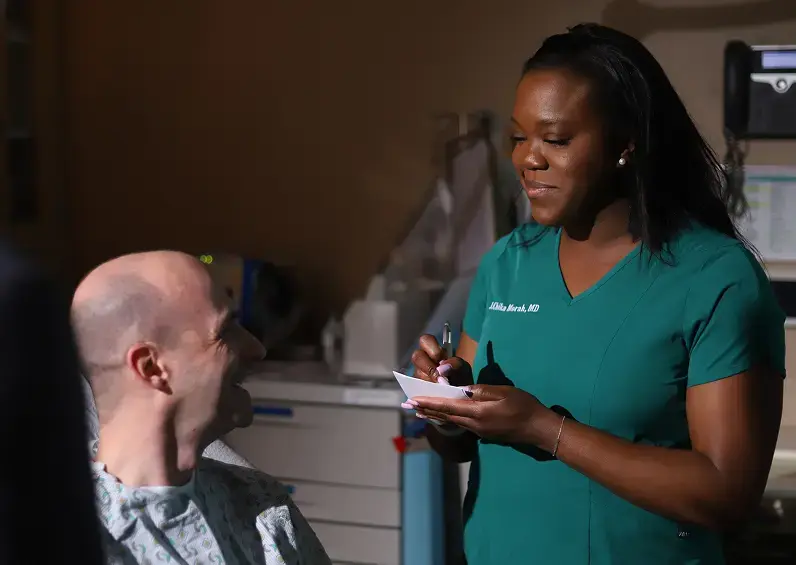 Nurse writing in a hospital setting