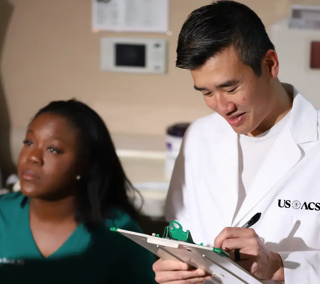 Doctor writing down details about a patient