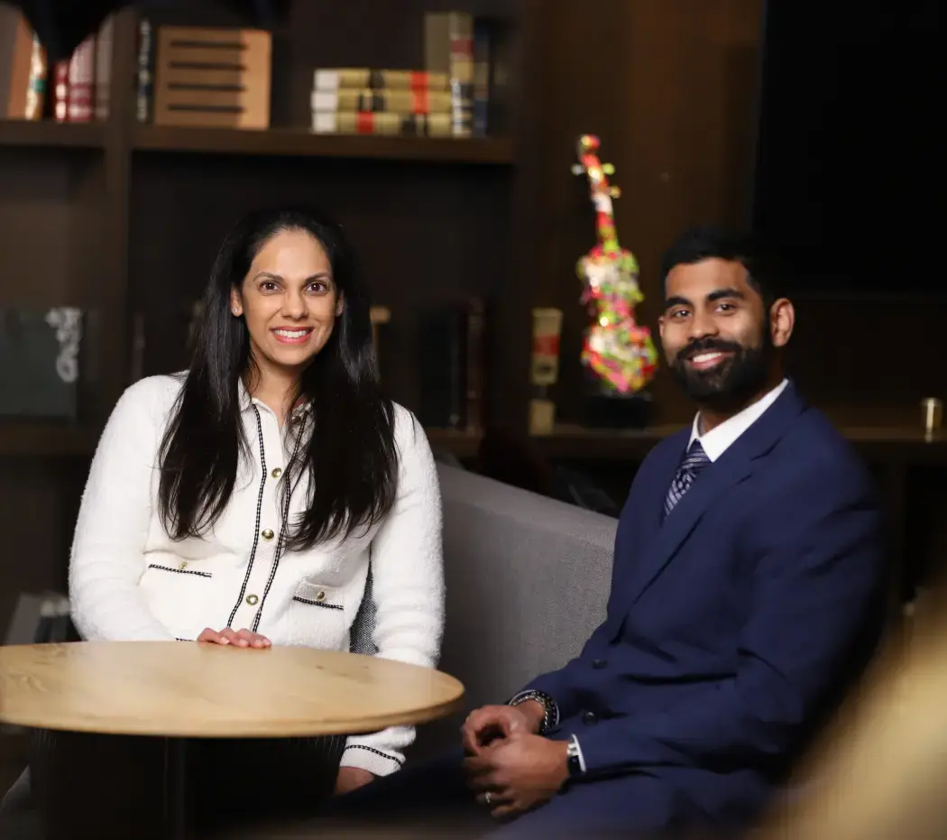 Two corporate employees of USACS smiling