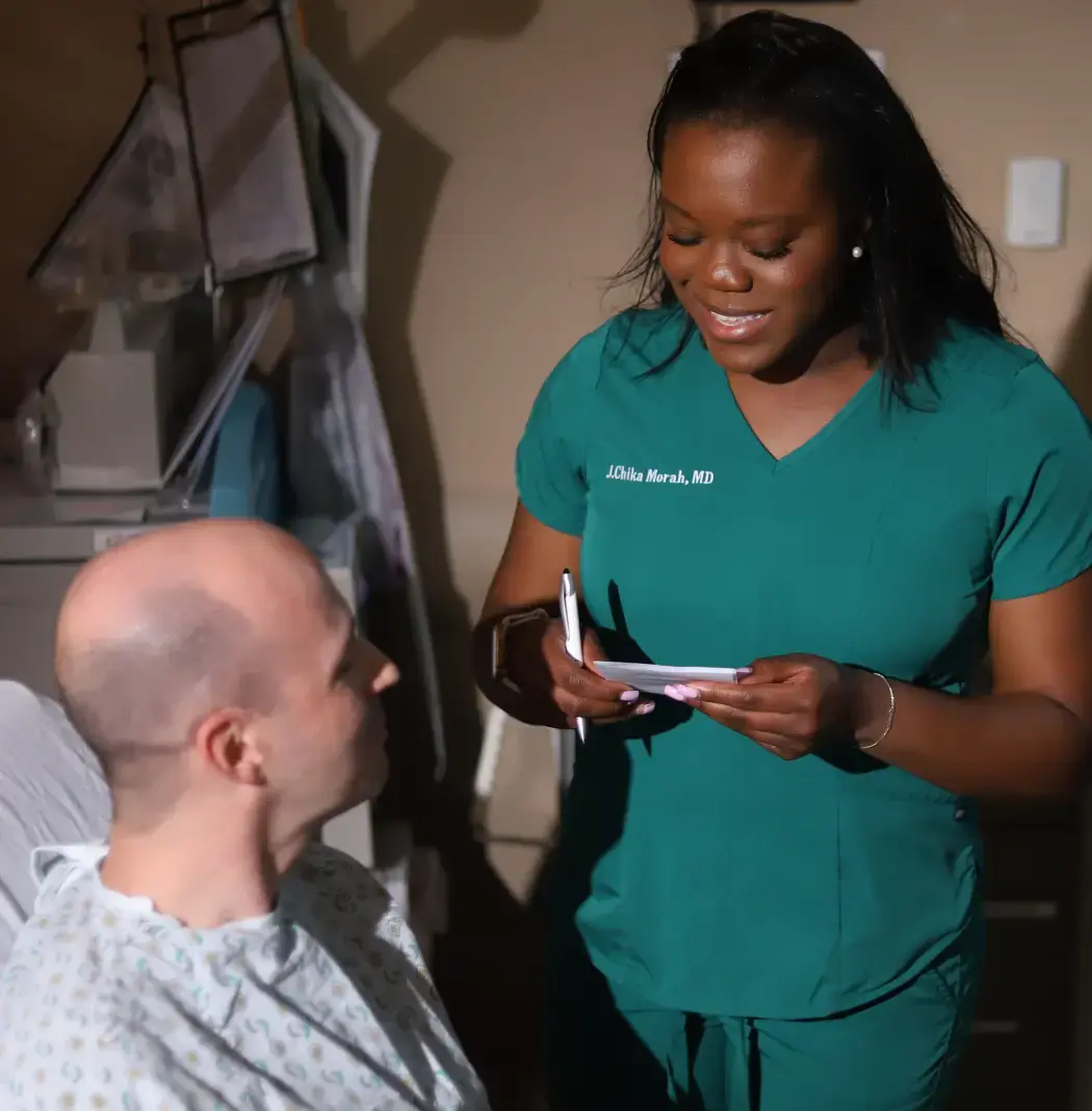 Scholar doctor talking to patient