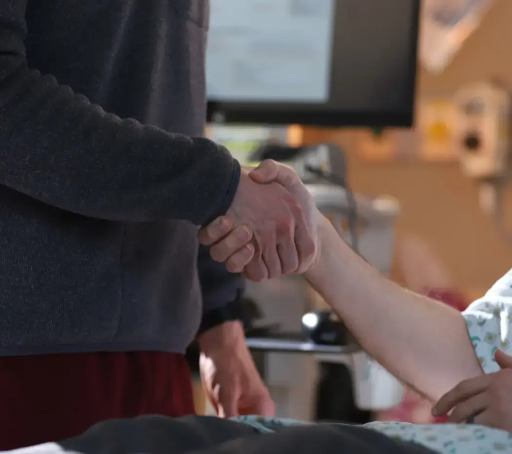 Doctor and patient shaking hands