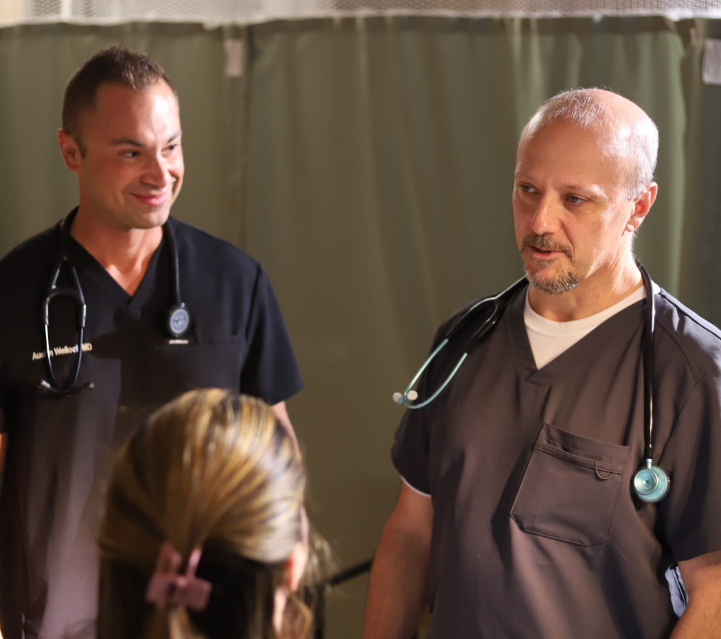 doctors talking to a patient